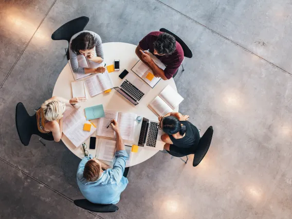 Birds' eye view of students around a table