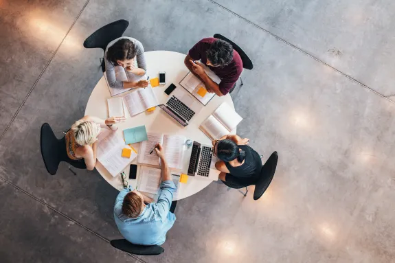 Birds' eye view of students around a table